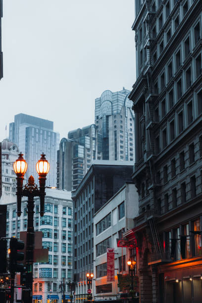 View of Moody Rainy Morning at San Francisco Downtown District, California Dramatic View of modern building exterior of central district of San Francisco city during foggy mist morning, the United States columbus avenue stock pictures, royalty-free photos & images