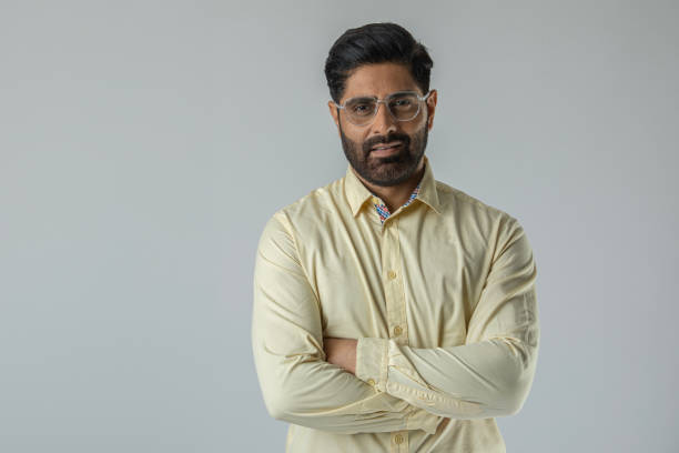 istock Confident businessman with arms crossed over white background 1629282313