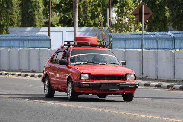 Vintage hatchback car driven on the street