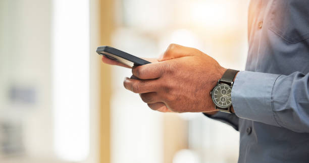 istock Hands, business man and search smartphone with social network, mobile website and internet contact. Closeup of office worker,  cellphone user and reading corporate news app while typing information 1629295946