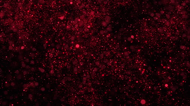 Abstract background red shiny particles falling down on black background