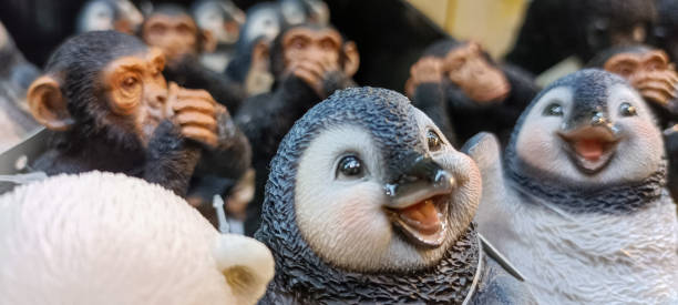 Some cute children's toys penguins and monkeys