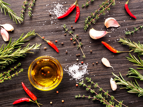 Culinary Ingredients Flat Lay - Thyme, Rosemary, Garlic, Chili, Sea Salt, Olive Oil.