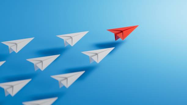 istock Leadership concept with red paper plane leading among white on blue background.3D rendering on blue background. 1629327738