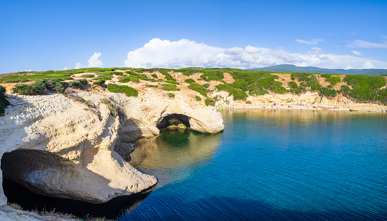 Limestone rock and clear waters at S'Archittu, a very popular tourist attraction in western Sardinia (5 shots stitched)