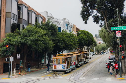 March 19, 2023: walking the central street of San Francisco, California with authentic cable cars