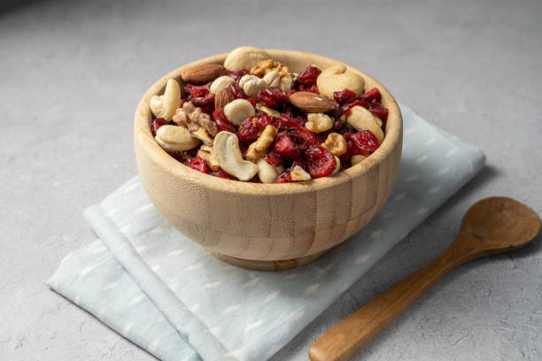 istock Mix of nuts cashews, almonds, hazelnuts with dried cranberries. 1629334336