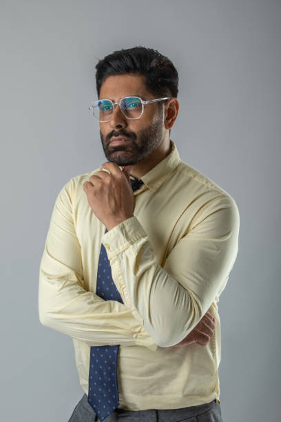 istock Confident businessman with arms crossed over white background 1629346064