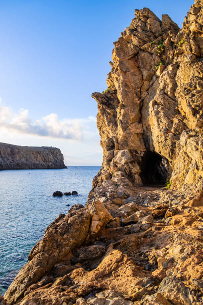 istock High cliffs frame the Cala Domestica Bay, western Sardinia - Italy 1629369490