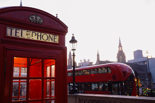 Row of five classic traditional red telephone boxes, London, England