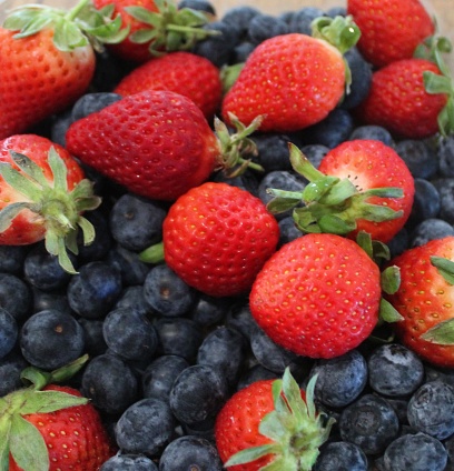 Background of fresh strawberries and blueberries