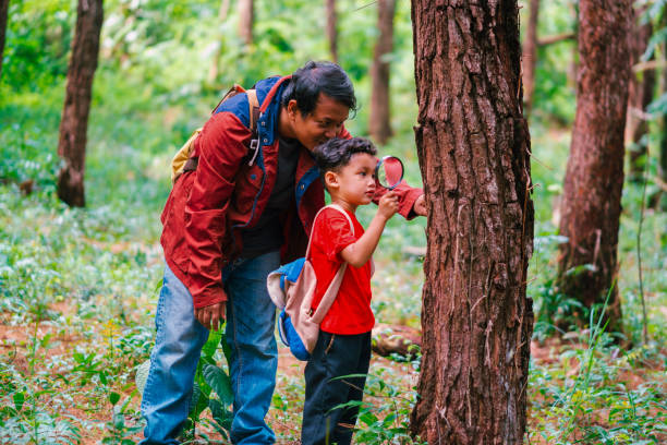 istock Asian father and son discovering nature together. 1629418612