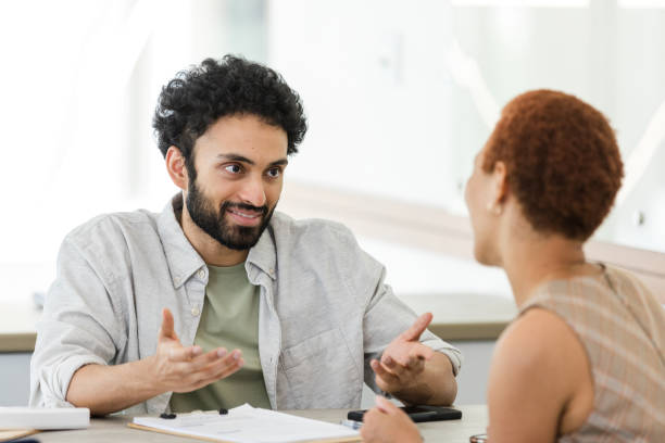 istock Diverse partners discuss business strategy 1629420381