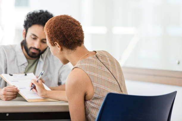 istock Unrecognizable businesswoman signs application 1629420387