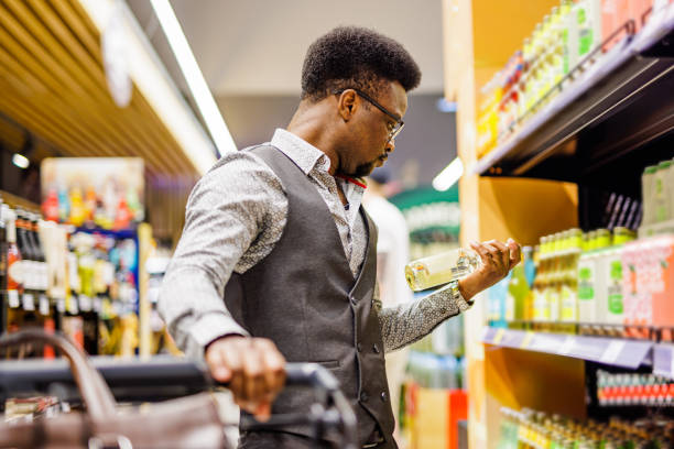 istock Man buying beer in supermarket 1629444415