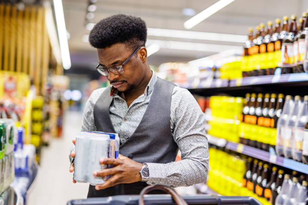 istock Young man buying beer 1629444422