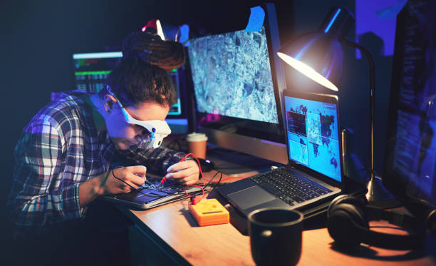 istock Woman, computer technician and motherboard with circuit, electronics or soldering iron with goggles in lab. Information technology, maintenance and programming for future, hardware or system in night 1629456055