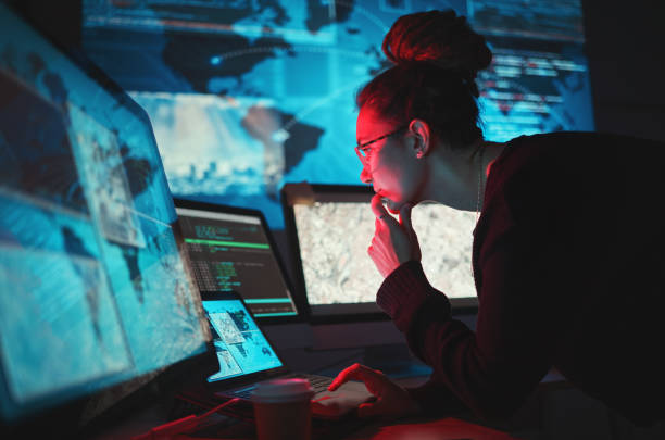 istock Cybersecurity, woman and computer with global network for phishing, ransomware and cyber search. Maps, digital database and IT worker in dark room for virtual malware hacking fix of a employee back 1629459869
