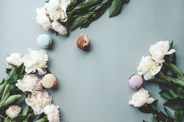 istock Beautiful summer wallpaper, background with place for your text, macarons and peonies 1629466029