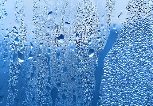 Natural water drops on glass, close-up