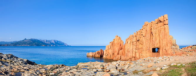 Rocce Rosse - Red Rocks of Arbatax, porphyry stacks with the characteristic red color located on the shoreline of the village (3 shots stitched)