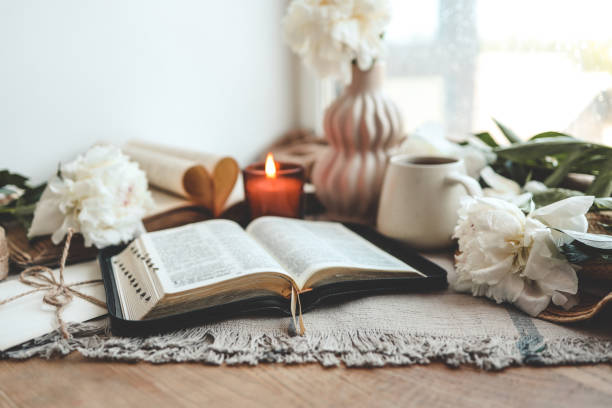 istock Open bible in home morning interior 1629481622