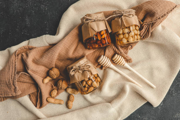 Craft jars with honey and nuts top view
