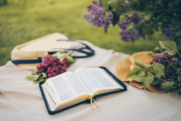 istock Open bible in the garden, christian concept 1629499673