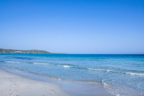 Fine white sand and turquoise water at the Beach of Capo Comino