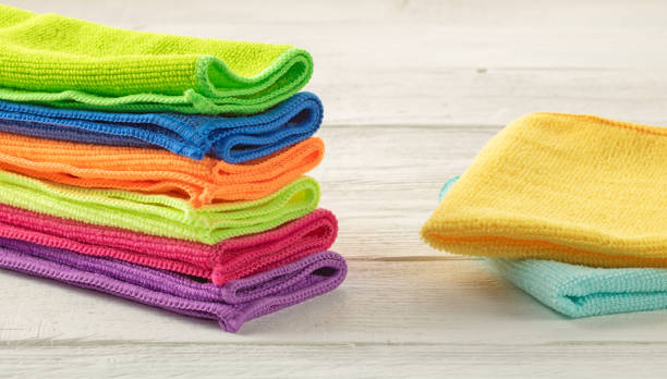 istock Stack of kitchen microfiber towels in bright colors on a white wooden background 1629507001