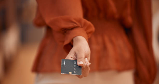 Person hand, credit card and offer of payment, finance e commerce and point of sale, retail or fashion store. Debit, banking and investment of customer closeup for clothes shopping at POS transaction Person hand, credit card and offer for payment, financial e commerce and point of sale, retail or fashion store. Debit, banking and investment with customer closeup in clothes sale or POS transaction clothing store credit card stock pictures, royalty-free photos & images