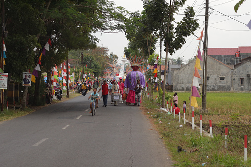 Cilacap, Indonesia August 21, 2023 : a group of people wearing traditional clothes from Betawi Indonesia in order to take part in the carnival celebration of the independence of the Republic of Indonesia