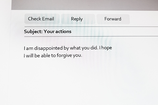 Photograph of a computer screen displaying an email message with the subject line \