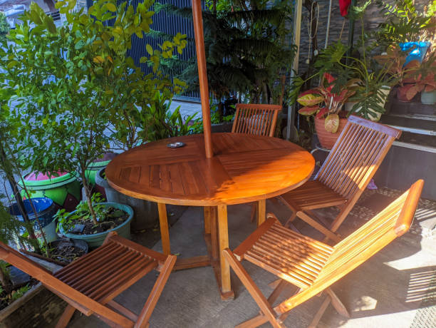 istock a round wooden table with chairs 1629516612