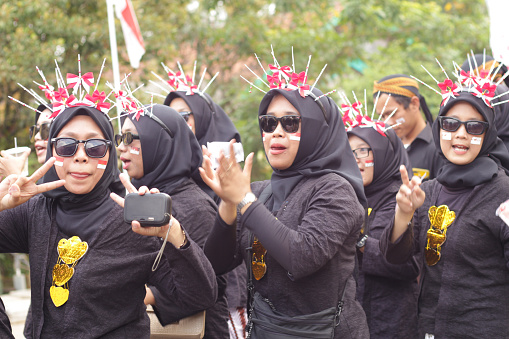 Cilacap, Indonesia August 21, 2023 : a group of women wearing traditional clothes from Java, Indonesia in order to take part in the carnival celebration of the independence of the Republic of Indonesia