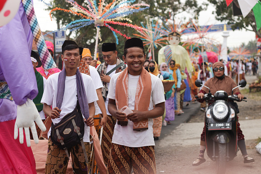 Cilacap, Indonesia August 21, 2023 : a group of people wearing traditional clothes from Betawi Indonesia in order to take part in the carnival celebration of the independence of the Republic of Indonesia