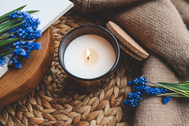 istock Candle and flowers in home atmospheric interior 1629520104
