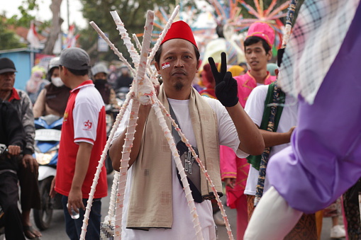 Cilacap, Indonesia August 21, 2023 : a group of people wearing traditional clothes from Betawi Indonesia in order to take part in the carnival celebration of the independence of the Republic of Indonesia
