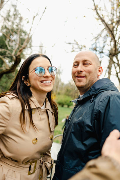istock Happy romantic couple enjoying a walk in the park 1629535338