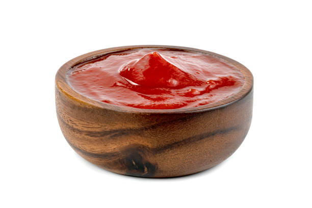 istock tomato sauce in wooden bowl isolated on white background 1629546806