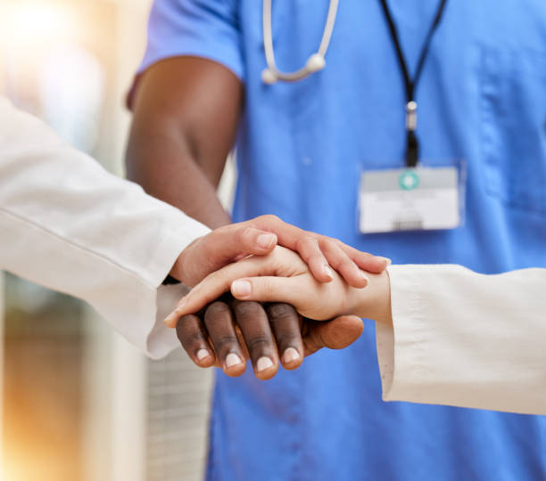 istock Doctors, teamwork and hands together for support, collaboration and healthcare motivation, goals and faith. Hope, diversity and stack sign of medical people with clinic, hospital or surgery goals 1629549634