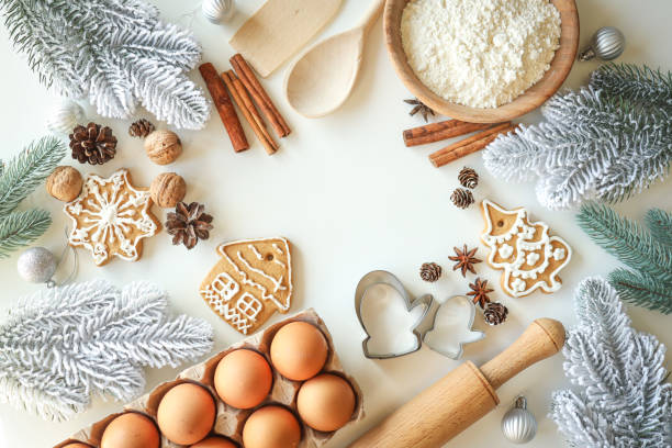 istock Bakery background with ingredients for cooking Christmas baking. Flour, eggs, cinnamon and gingerbread on the table top view 1629564216