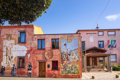 Moments of rural and village life are depicted on the façades of the houses of Tinnura, a little village famous for the numerous and very realistic murals created in the years by different artists