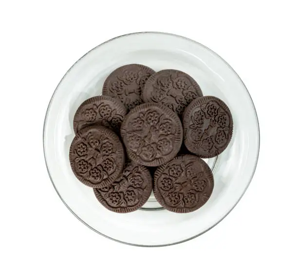 black chocolate cookies in a glass plate isolated on white background ,include clipping path