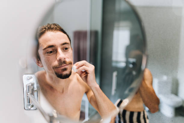istock Mid adult man getting ready in the bathroom at home 1629586597