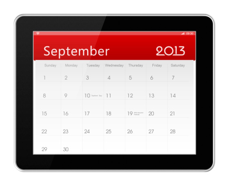 September 2013 Calender on digital tablet (Clipping path!) isolated on white.