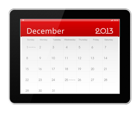 December 2013 Calender on digital tablet (Clipping path!) isolated on white.