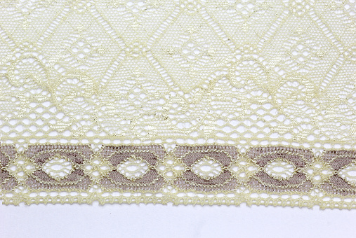 the macro photo of the fabric with lace