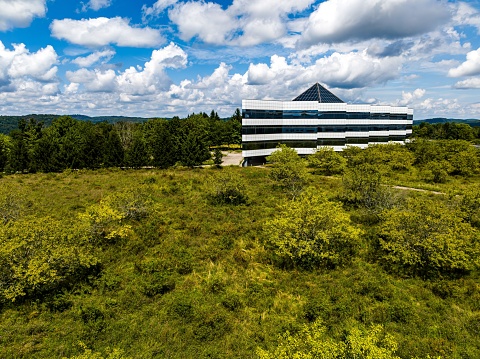 Somers, United States – August 13, 2023: An aerial view of a large futuristic office complex in upstate New York on a sunny day