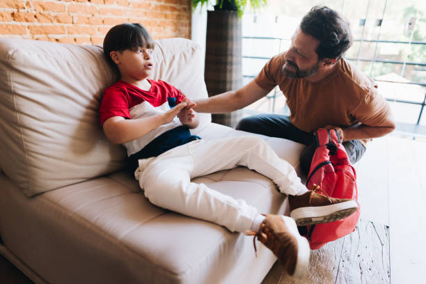 istock Father talking to son at home 1629591671